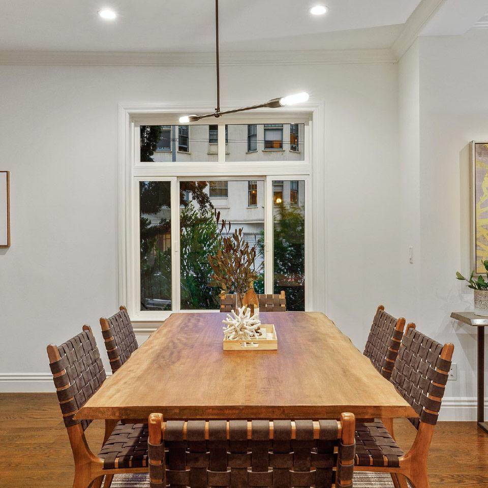 Dining-room-table View of a dining room with a large wood table