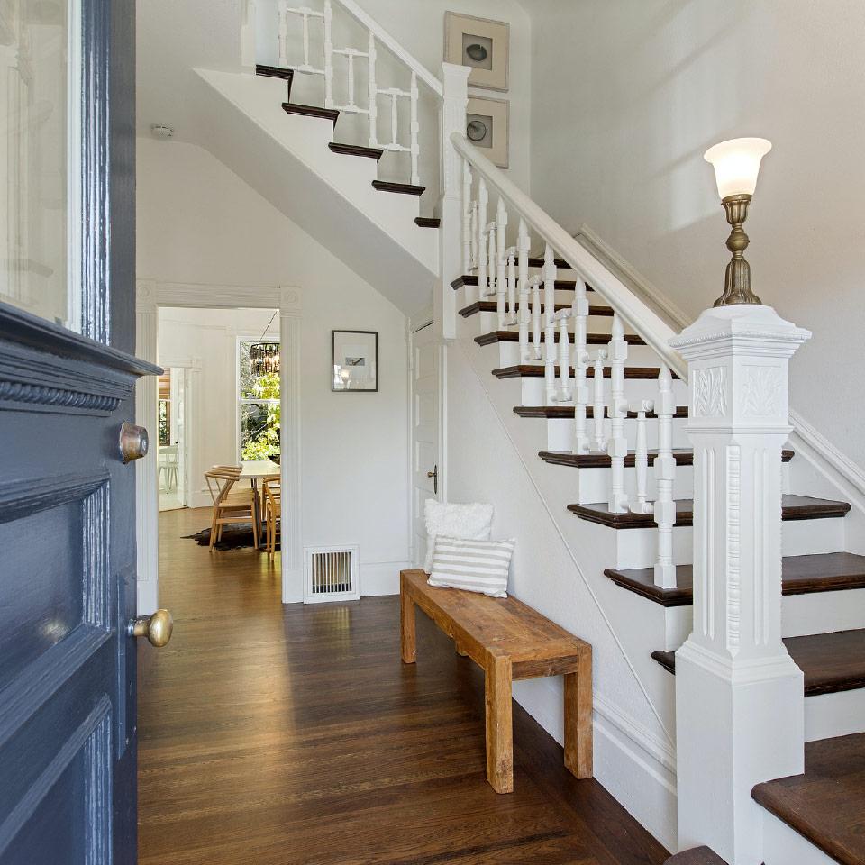 View of a white wood staircase leading up