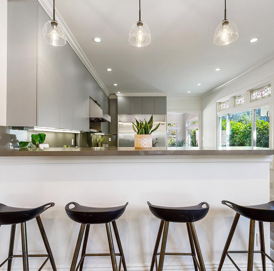 View of a kitchen with counter seating