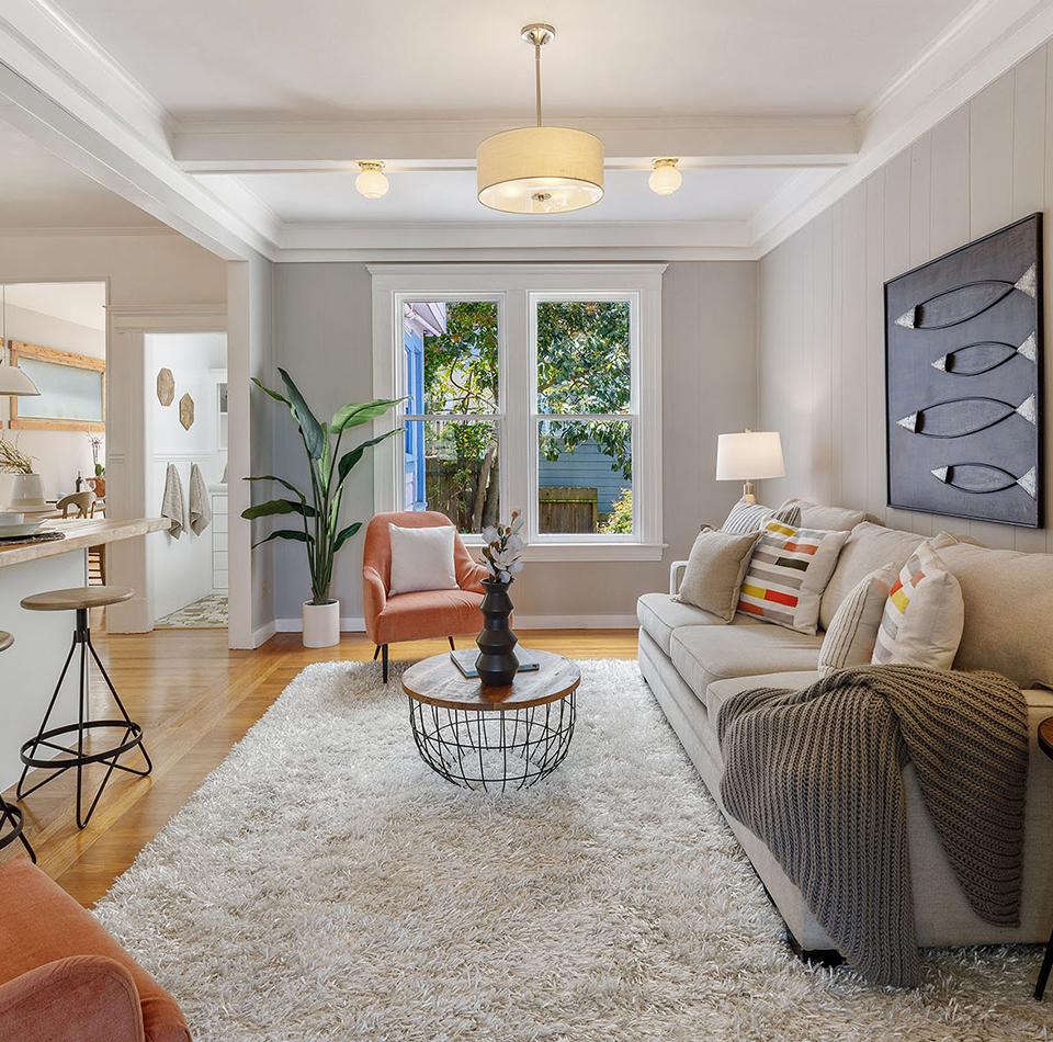 View of a living room with wood floors and plenty of natural light