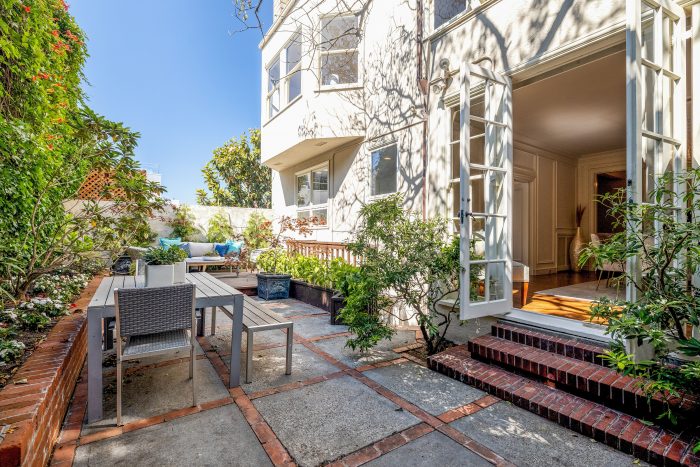 Exterior view of a patio and outdoor dining area