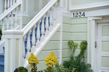 Side-view of steps with white railing 