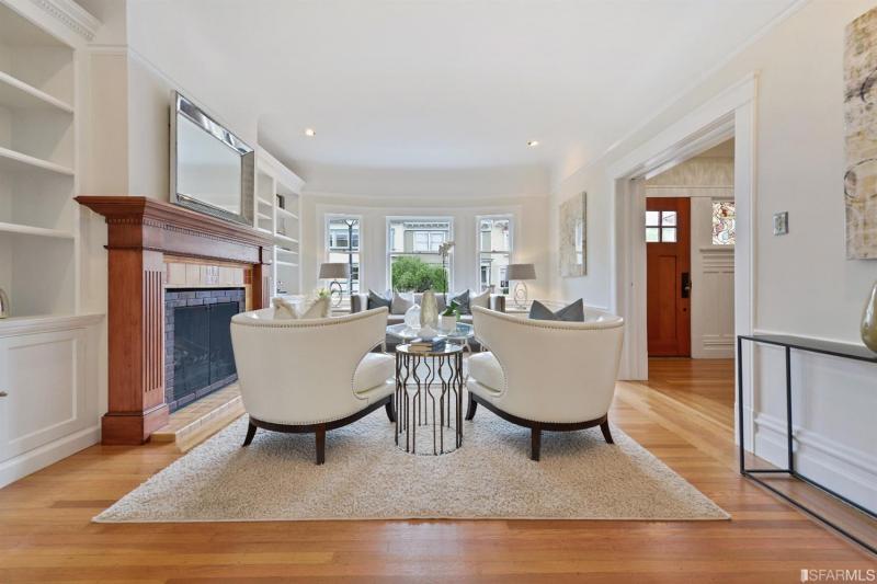 View of the living room at 1234 5th Avenue, featuring wood floors