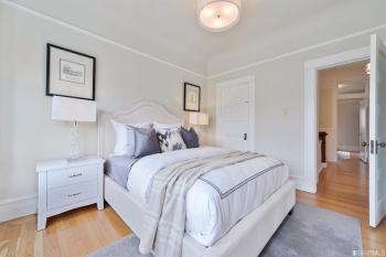 Bedroom one, featuring pale grey walls