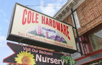 Sign for nearby business, Cole Hardware