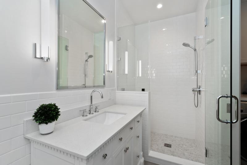 White bathroom with large white vanity 