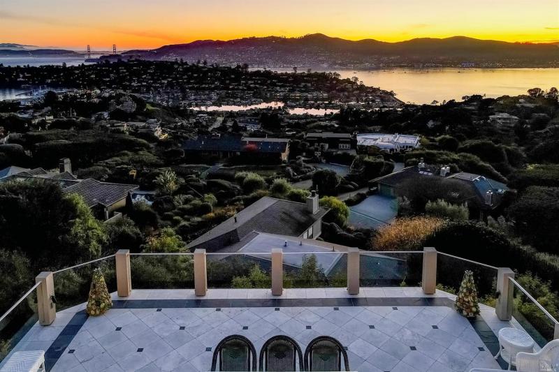 A view from the expansive balcony at 10 Venado Drive, featuring twilight views of the San Francisco Bay