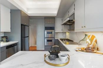 Kitchen at 2832 Union Street, featuring marble counters and light grey cabinetry