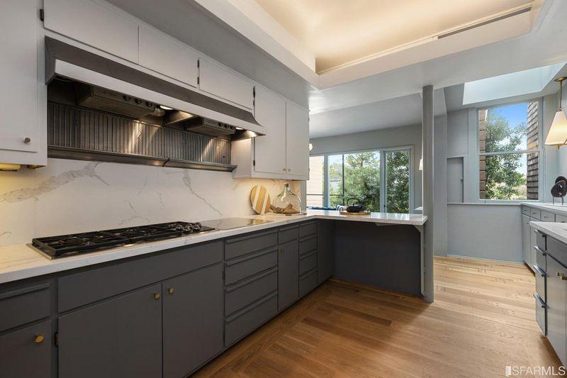 View of the kitchen at 2832 Union Street, featuring dark grey lower cabinets and light grey upper cabinets