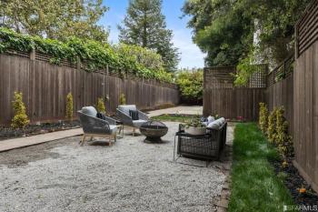 View of a long, spacious back yard with seating area at 2832 Union Street