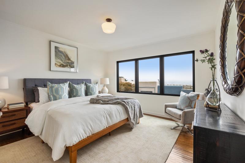 Bedroom with large windows at 450 Los Palmos Drive