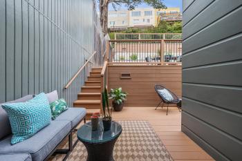 Outdoor area at 450 Los Palmos Drive, highlighting a lower and upper patio