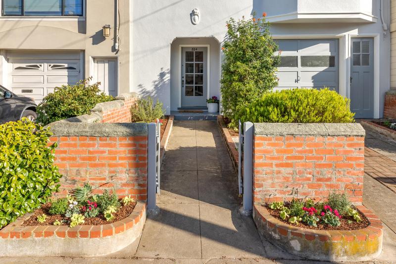 View of the of front gate and pathway leading to 884 43rd Avenue
