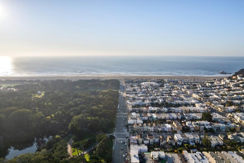 View of the neighborhood looking west to ocean from a drone