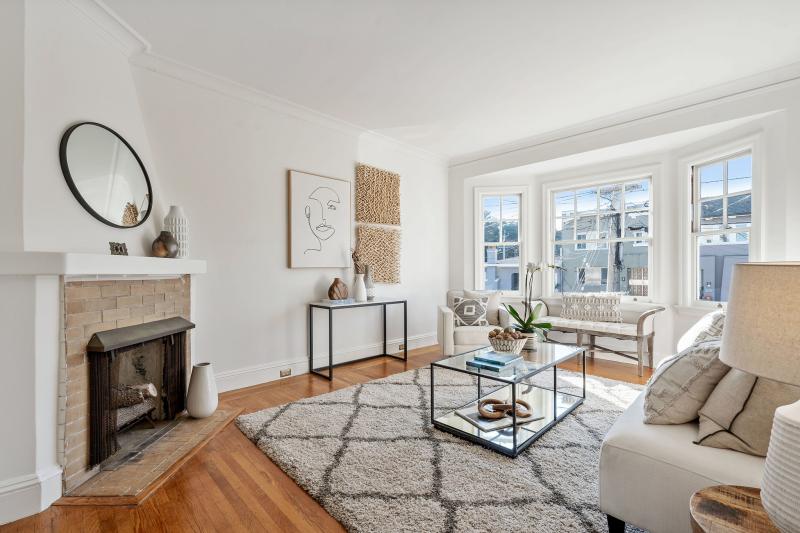 View of the living room, showing a fireplace