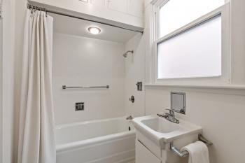View of the bathroom sink and shower