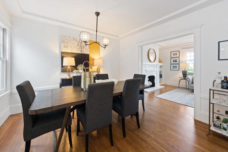 Formal dining room with a view into the living room