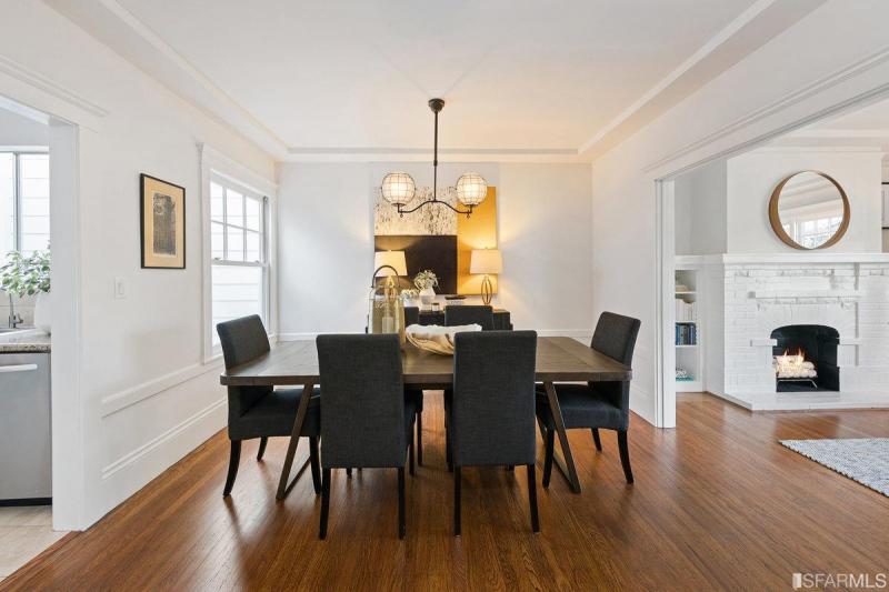 Formal dining area with wood floors and open floor plan