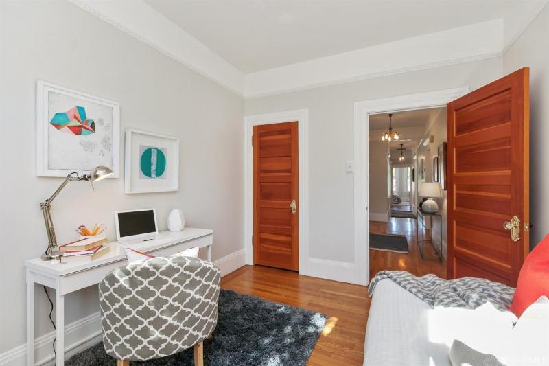 View from the window of bedroom two, showing a bed and desk