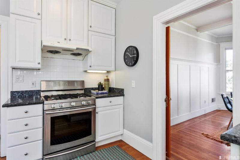 View of the kitchen, featuring the stove