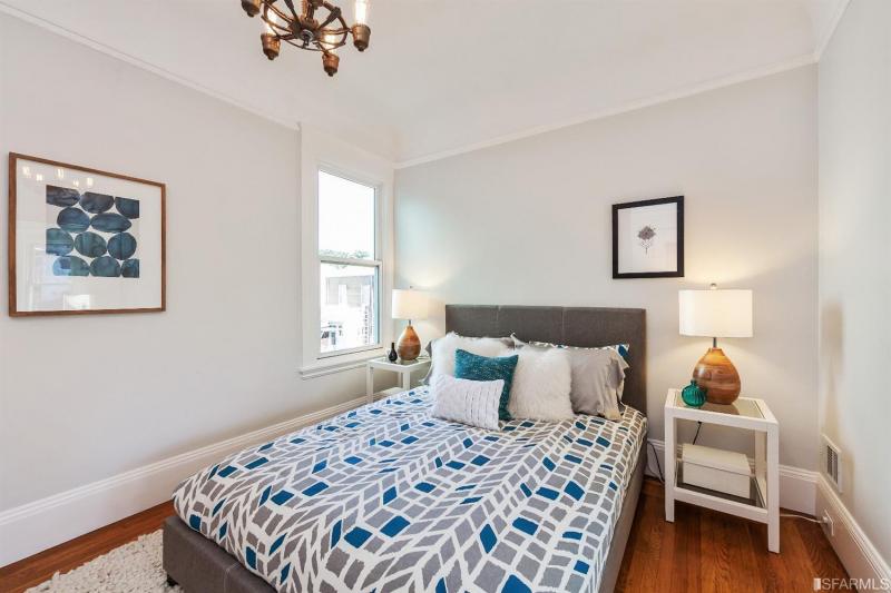 Bedroom one, featuring wood floors in unit two