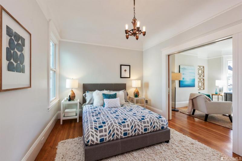 Bedroom with a view of the living room, in unit two