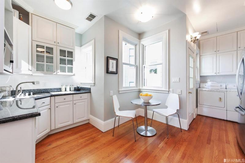 Kitchen for unit two, featuring wood floors