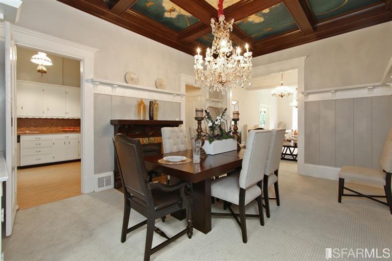 Formal dining room, featuring wood panel walls