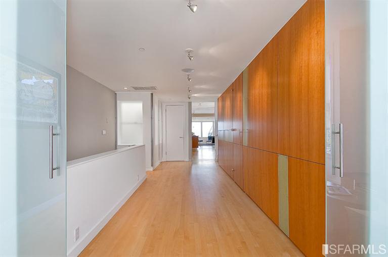 View of hallway with wood floors