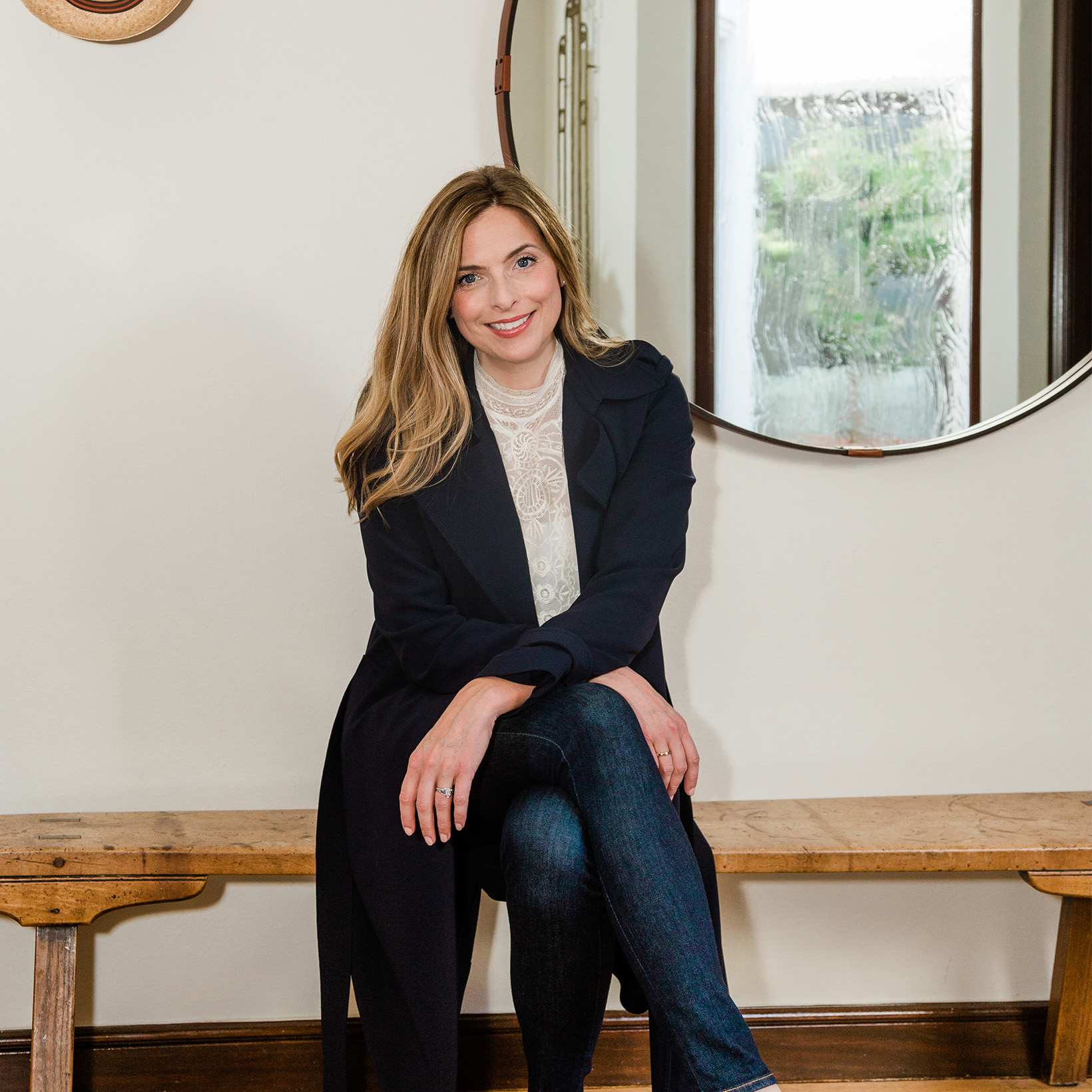 Photo is of Shannon Hughes sitting on wooden bench.